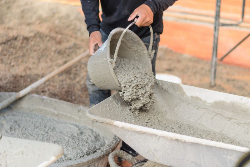 concrete worker mixing concrete