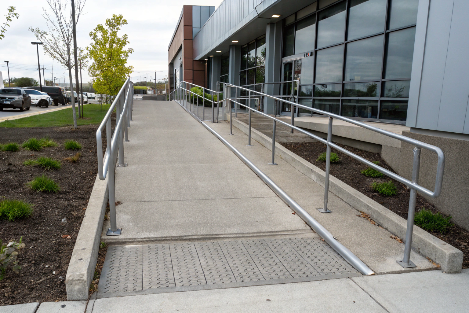 Professional concrete wheelchair ramp with compliant construction